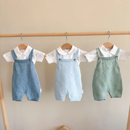Pagliaccetto neonato in cotone pompon
