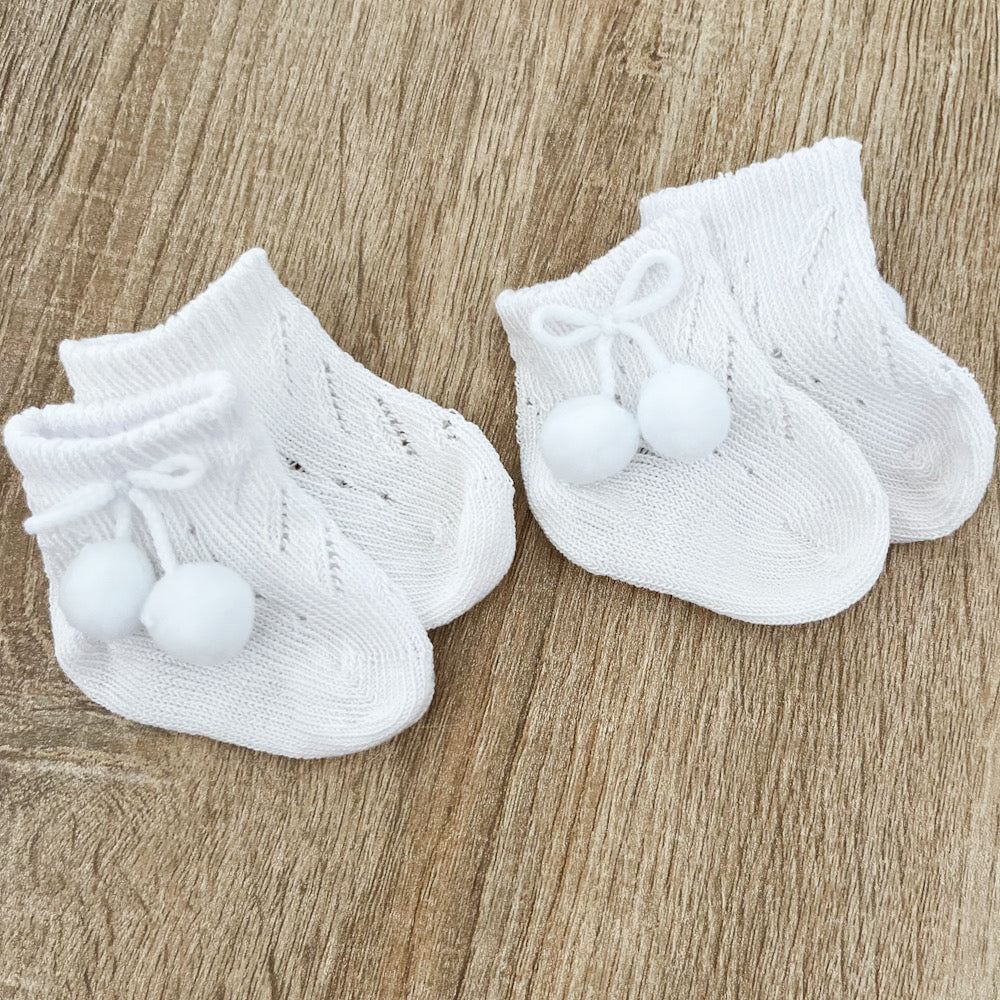 Calzino neonato pompon