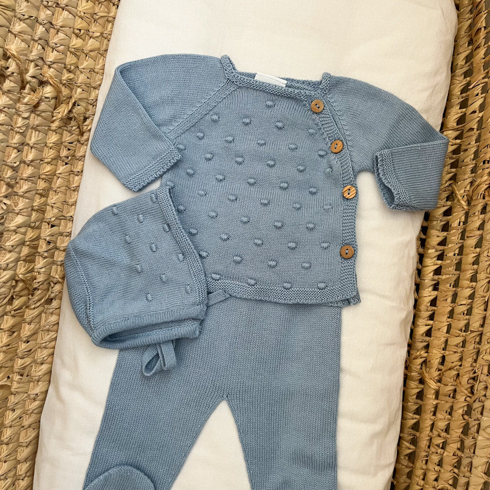 Completino neonato pompon con cuffietta