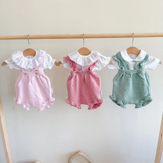 Pagliaccetto neonato in cotone pompon con voulant