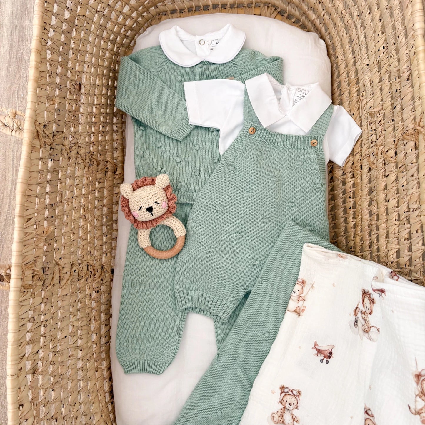 Pagliaccetto neonato in cotone pompon